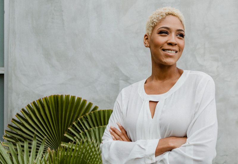 Professional woman thinking about which staffing agency to partner with. 