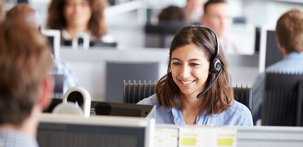 A call centre rep helping a customer using the training skills she received from TalentWorld onboarding. 